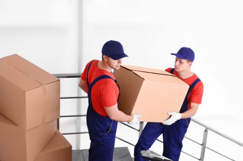 House movers loading furniture for a move in Merton
