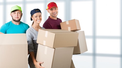 Packed household items and protective wrapping for a Merton move