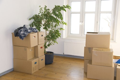 Moving truck and packed boxes for service coverage across Merton