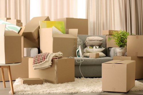 Prepared moving boxes and furniture ready for transport in Merton